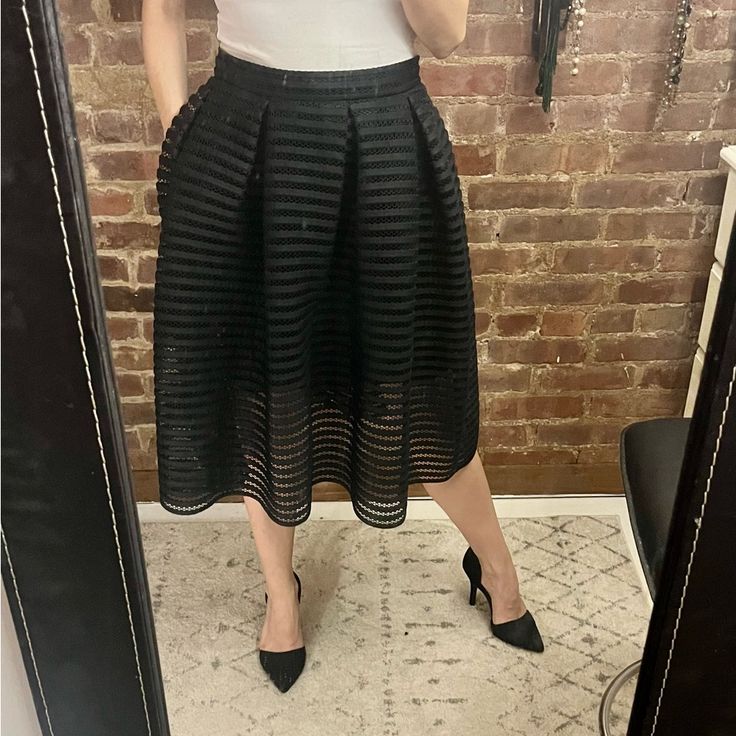 Maje Bubble Party Skirt. Spring Party Tiered Skirt, Black Party Skirt For Fall, Black Fall Party Skirt, Chic Skirt For Spring Evening, Chic Evening Skirt For Spring, Chic Spring Evening Skirt, Spring Evening Skirt Bottoms, Tiered Skirt For Party In Fall, Flared Skirt For Evening In Spring