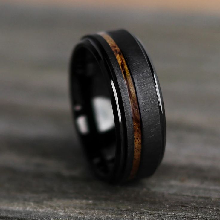 black ceramic ring with wood inlays on top