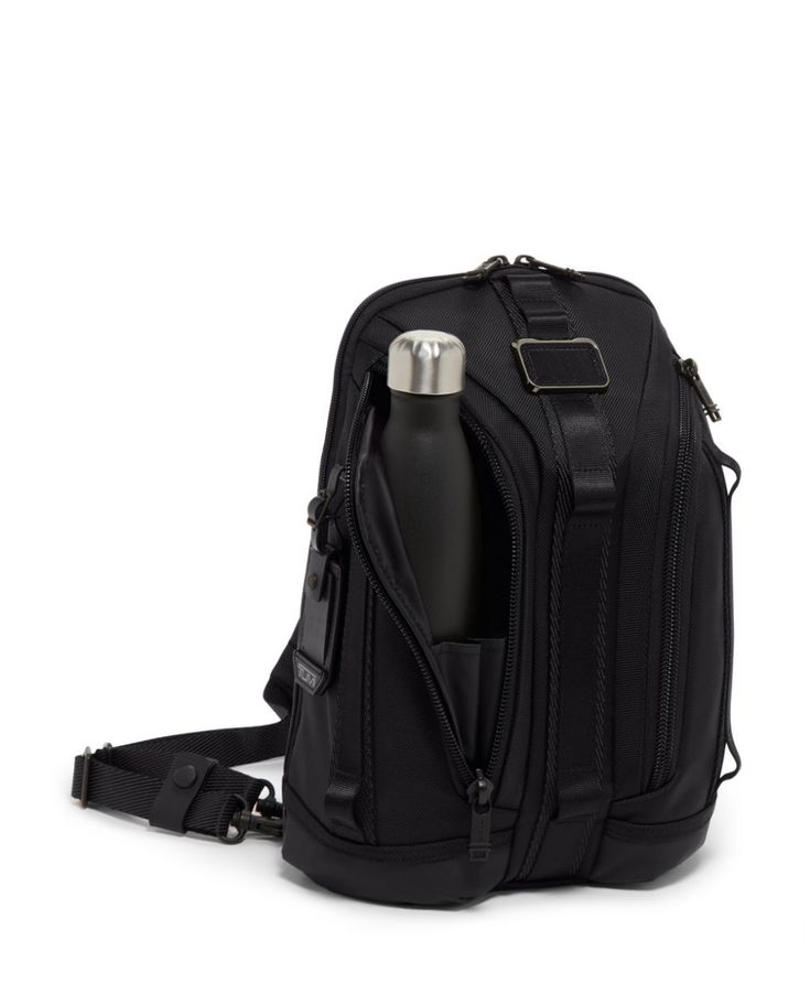 a black backpack with a water bottle in the front pocket and strap around the shoulder