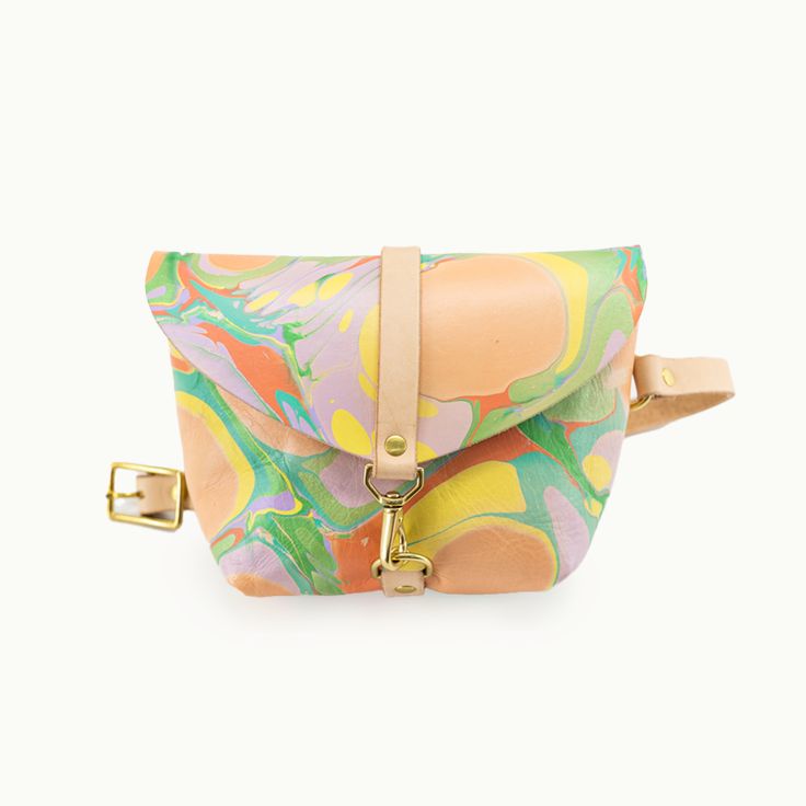 Marbled Colorful*Bag shown is Marbled Colorful with a natural strap. Our marbled items are one-of-a kind, the bag you will be receiving will not be this exact bag. This listing is for a colorful palette. Everyone's favorite little bag, now roomier. Our best selling bag is as versatile as they come -- wear it cross body, across your hips, at your natural waist, or throw it over your shoulder. Tuck it under your arm when you're on that crowded train or at that concert. Whatever your next adventure Multicolor Crossbody Satchel With Mobile Phone Bag, Multicolor Leather Saddle Bag For Daily Use, Multicolor Pouch Shoulder Bag With Adjustable Strap, Multicolor Crossbody Saddle Bag For Travel, Colorful Crossbody Shoulder Bag For Travel, Multicolor Shoulder Bag With Adjustable Strap, Multicolor Crossbody Saddle Bag With Adjustable Strap, Colorful Crossbody Bag With Adjustable Strap, Multicolor Crossbody Shoulder Bag With Detachable Strap