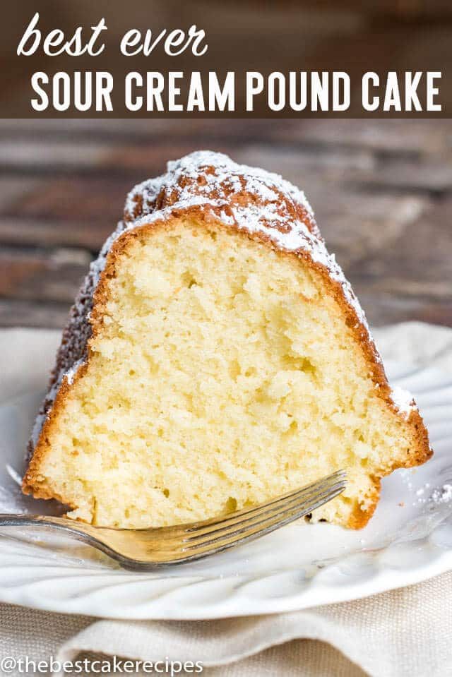 the best ever sour cream pound cake on a white plate with a fork in it