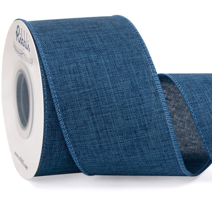 a roll of blue cloth tape on a white background