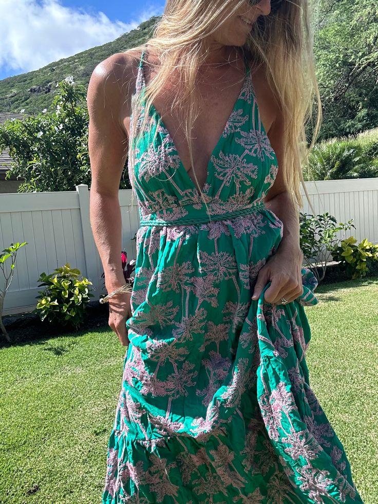 Add a playful pop of color to your wardrobe with the MAAJI Embroidered Palms Moon Bay maxi dress. Made from a luxurious blend of rayon and polyester, this limited edition style features intricate embroidery for a unique touch. Perfect for any occasion, this maxi dress will have you looking and feeling fabulous! Green Long Sundress For Beach, Green Long Sundress For The Beach, Green Beach Dress For Holidays, Green Beach Season Dresses, Sleeveless Sundress Maxi For Resort Season, V-neck Embroidered Maxi Dress For Summer, Green Beach Holiday Dresses, Flowy V-neck Maxi Dress For Holiday, Green Rayon Summer Maxi Dress