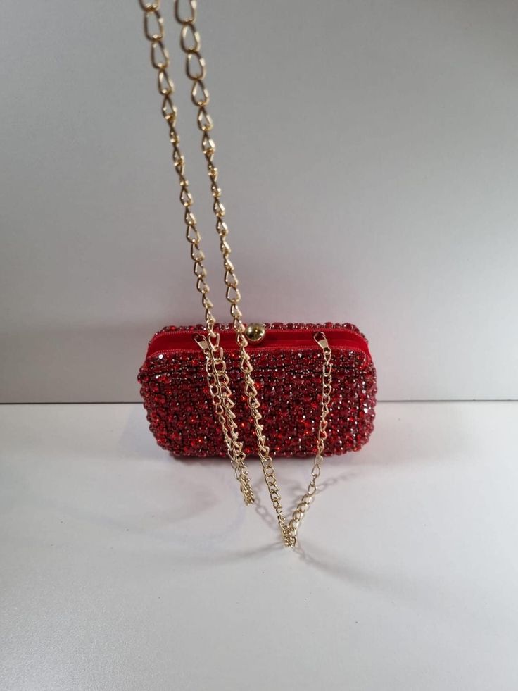 A stunning clutch purse in a beautiful deep red. A statement piece that will make any outfit. You will fall in love at first sight! Rhinestone Clutch For Night Out, Burgundy Rectangular Clutch For Evening, Chic Burgundy Rectangular Clutch, Burgundy Rectangular Evening Clutch, Glamorous Red Evening Clutch, Rectangular Burgundy Evening Clutch, Burgundy Clutch Bag For Party, Rectangular Rhinestone Clutch For Night Out, Rectangular Burgundy Clutch For Party