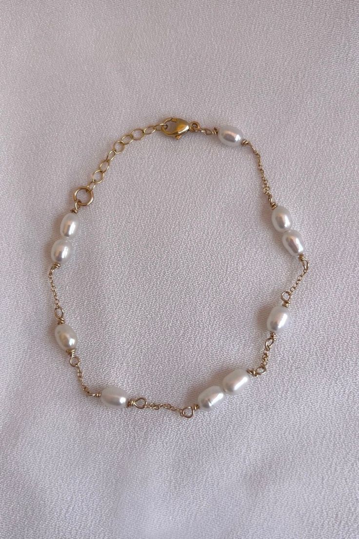 A handmade 14k Gold filled organically shaped pearl bracelet. This elegant bracelet is perfect everyday wear or special occasions and a wonderful  Gift for Mom, Wife, Friend, Sister, Grandmother and Daughter. HOW TO ORDER 1. First, select your bracelet size in the drop down box 1. Then, select your desired metal, bracelet type/set and add to cart! BRACELET MEASURING GUIDE: Average Women's Sizing: 5-6.5 inches = extra small 6.5-7 inches = small 7-8 inches = medium 8 inches+ = large *We recommend Handmade Dainty Gold Pearl Bracelet, Dainty Handmade Gold Pearl Bracelet, Elegant Handmade 14k Gold-filled Pearl Bracelet, Elegant Handmade 14k Gold Filled Pearl Bracelet, 14k Gold-filled Bracelets With Pearl Drop, Gold Bracelets With Pearl Drop In 14k Gold Filled, Handmade 14k Gold-filled Pearl Bracelet, Gold Pearl Bracelet With 14k Gold Filled Pearl Chain, Gold 14k Gold Filled Pearl Chain Bracelet