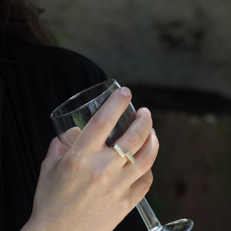 This is a unique geometric 14k solid gold ring. The ring is handmade of yellow 14k solid gold, and its finish is smooth and shiny. The rectangles have a delicate scratched finish. The meeting point of the rectangles, at one corner, reminds me of a kiss. A minimalist, modern, and eye catching ring. Ring's size is 6 1/4 Rectangle's width is approx. 4 mm = 0.15 inch each Rectangle's length is approx. 11.5 mm = 0.45 inch each * The ring will be packed in a gift box ready to give as a gift, and shipp Modern Gold Stackable Rings With Tension Setting, Modern Stackable Rings With Tension Setting For Gift, Modern Stackable Rings With Tension Setting As Gift, Elegant Recycled Gold Open Signet Ring, Modern Open Signet Ring In Recycled Gold, Modern 14k Gold Diamond Ring, Gold Minimalist Initial Ring For Anniversary, Modern Midi Rings With Polished Finish As Gift, Modern Midi Rings With Polished Finish For Gifts