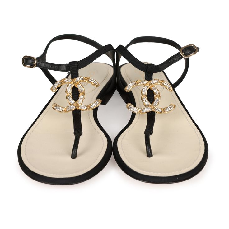 These Chanel Jeweled CC Thong Sandals are in Black Canvas with Gold Hardware. This sandal features a Gold Jeweled CC on the front of the sandal, an adjustable strap, natural leather insole, and rubber sole. Origin: ItalyCondition: New and never wornAccompanied by: Chanel box, dustbagsSize: 37 EU Braiding Styles, Chanel Box, African Hair, Hair Braiding, Best Bags, Vuitton Bag, Black Canvas, Thong Sandals, Handbag Backpack