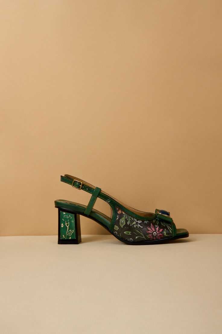 Elevate your style with Soffia's Gracelynn Floral Embossed Slingback Sandals. The bold and unique embossed floral design will add a touch of adventure to any outfit. Stride confidently on the block heels and embrace your fearless side. These sandals are the perfect fusion of fashion and risk-taking. 2.56" heel Hook & loop buckle closure Genuine leather upper Leather footbed Leather lining Leather midsole Rubber sole Summer Green Slingback Pumps With Heel Strap, Green Slingback Sandals With Heel Strap For Spring, Spring Green Slingback Sandals, Spring Green Low Heel Slingback Sandals, Green Slingback Sandals For Spring, Green Low Heel Slingback Sandals For Spring, Green Low Heel Slingback Sandals, Green Slingback Pumps With Padded Heel For Summer, Green Block Heel Slingback Pumps For Summer