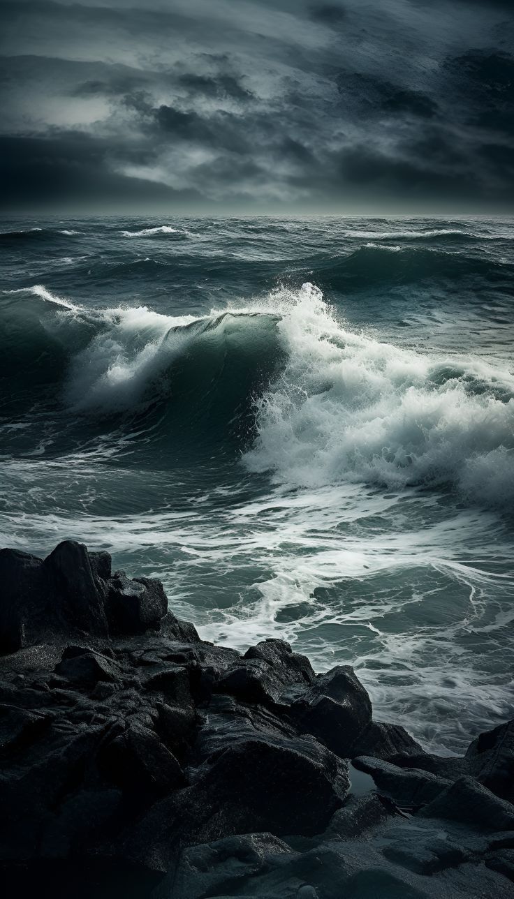 an ocean with waves crashing on rocks under a cloudy sky and dark clouds in the background