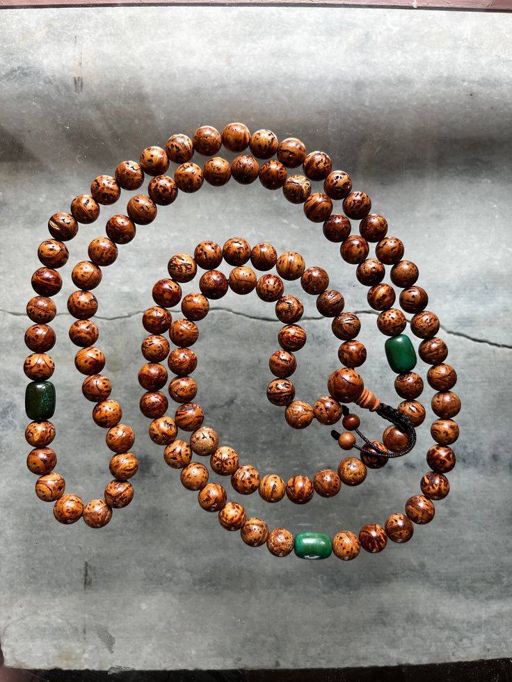 This Indian bodhi seed mala with 3 turquoise markers beads is a especially for ngondro accumulation strung with 111 beads, (at the  21st, 25th and center place)  If one isn't engaged ngondro practice at this time, the special beads can be skipped to equal a count 108 beads.  The Indian Bodhi seed beads are 11mm The Turquoise beads are natural, undyed, barrel and measure 11x14mm There are slight differences in the turquoise for the 2 malas.  This mala is specially strung with care and intention by a practitioner. With use in a short time, develop a beautiful patina. This is a special mala to treasure for years.🙏 Please contact me if you have any problems with your order. The following items can't be returned or exchanged * Custom or personalized orders Returns and exchange details Your sat 3rd Eye, 108 Bead, Mala Beads, Prayer Beads, Turquoise Beads, Bead Charms, Seed Beads, Markers, Turquoise