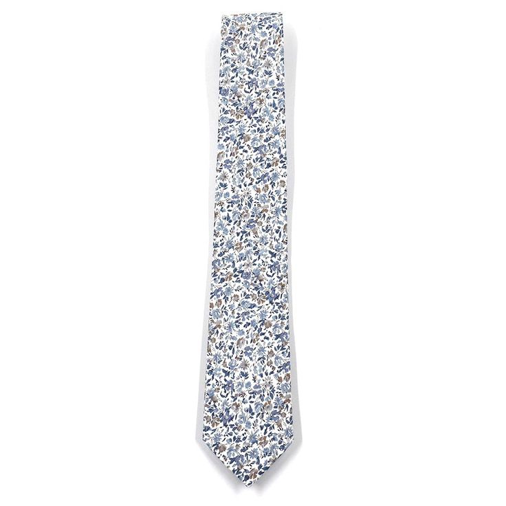 Handmade with 100% imported cotton fabric. Perfect for work, weddings or a night out on the town. This Floral Mist Blue Tie will make you feel like the gentleman you aspire to be or accentuate the gentleman you already are. You’ll look good, feel good and do good things in this tie. Makes the perfect gift for a fellow gentleman or for that man in your life by making them look good and feel good. We guarantee your satisfaction with our free refund policy.* Goes Good With: Navy, Tan, Beige, Blue, Elegant Blue Cotton Ties, Dapper Cotton Ties For Formal Occasions, Dapper Cotton Tie For Formal Occasions, Formal Dapper Cotton Ties, Spring Business Cotton Suit And Tie Accessories, Elegant Cotton Ties For Spring, Cotton Ties For Workwear In Spring, Elegant Blue Cotton Suit And Tie Accessories, Elegant Cotton Suit And Tie Accessories For Summer