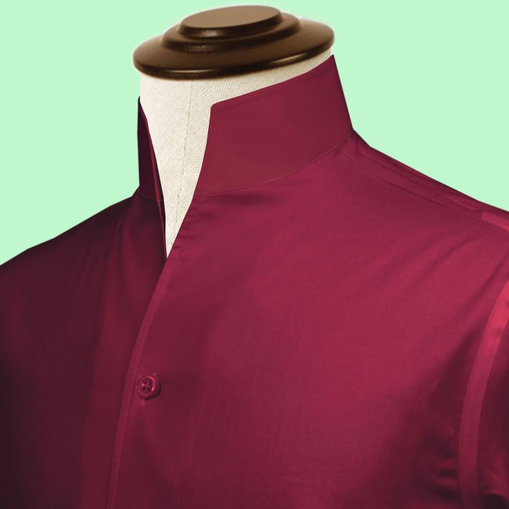 "High Open Collar Full Sleeves Shirt Tailor-Made On Order shirt 𝘈 𝘩𝘪𝘨𝘩 𝘤𝘰𝘭𝘭𝘢𝘳 𝘴𝘩𝘪𝘳𝘵 𝘪𝘴 𝘢 𝘤𝘭𝘢𝘴𝘴𝘪𝘤 𝘢𝘯𝘥 𝘵𝘪𝘮𝘦𝘭𝘦𝘴𝘴 𝘴𝘵𝘺𝘭𝘦 𝘵𝘩𝘢𝘵 𝘢𝘥𝘥𝘴 𝘢 𝘵𝘰𝘶𝘤𝘩 𝘰𝘧 𝘴𝘰𝘱𝘩𝘪𝘴𝘵𝘪𝘤𝘢𝘵𝘪𝘰𝘯 𝘵𝘰 𝘢𝘯𝘺 𝘰𝘶𝘵𝘧𝘪𝘵. 𝘛𝘩𝘪𝘴 𝘴𝘵𝘺𝘭𝘦 𝘧𝘦𝘢𝘵𝘶𝘳𝘦𝘴 𝘢 𝘤𝘰𝘭𝘭𝘢𝘳 𝘵𝘩𝘢𝘵 𝘴𝘵𝘢𝘯𝘥𝘴 𝘶𝘱 𝘢𝘯𝘥 𝘦𝘯𝘤𝘪𝘳𝘤𝘭𝘦𝘴 𝘵𝘩𝘦 𝘯𝘦𝘤𝘬, 𝘱𝘳𝘰𝘷𝘪𝘥𝘪𝘯𝘨 𝘢 𝘳𝘦𝘧𝘪𝘯𝘦𝘥 𝘢𝘯𝘥 𝘱𝘰𝘭𝘪𝘴𝘩𝘦𝘥 𝘭𝘰𝘰𝘬. 𝘐𝘵'𝘴 𝘢 𝘷𝘦𝘳𝘴𝘢𝘵𝘪𝘭𝘦 𝘱𝘪𝘦𝘤𝘦 𝘰𝘧 𝘤𝘭𝘰𝘵𝘩𝘪𝘯𝘨 𝘵𝘩𝘢𝘵 𝘤𝘢𝘯 𝘣𝘦 𝘸𝘰𝘳𝘯 𝘸𝘪𝘵𝘩 𝘢 𝘴𝘶𝘪𝘵 𝘧𝘰𝘳 𝘧𝘰𝘳𝘮𝘢𝘭 𝘰𝘤𝘤𝘢𝘴𝘪𝘰𝘯𝘴 𝘰𝘳 𝘥𝘳𝘦𝘴𝘴𝘦𝘥 𝘥𝘰𝘸𝘯 𝘸𝘪𝘵𝘩 𝘫𝘦𝘢𝘯𝘴 𝘧𝘰𝘳 𝘢 𝘤𝘢𝘴𝘶𝘢𝘭 𝘭𝘰𝘰𝘬. 𝘛𝘩𝘦 𝘩𝘪𝘨𝘩 𝘤𝘰𝘭𝘭𝘢𝘳 𝘢𝘭𝘴𝘰 𝘰𝘧𝘧𝘦𝘳𝘴 𝘢𝘥𝘥𝘪𝘵𝘪𝘰𝘯𝘢𝘭 𝘤𝘰𝘷𝘦𝘳𝘢𝘨𝘦 𝘢𝘯𝘥 𝘱𝘳𝘰𝘵𝘦𝘤𝘵𝘪𝘰𝘯 𝘢𝘨 Classic Red Shirt For Daywear, Classic Stand Collar Top With Button Closure, Classic Tops With Stand Collar And Button Closure, Classic Red Tops For Daywear, Classic Top With Stand Collar And Button Closure, Formal Solid Tops With Placket, Elegant Stand Collar Shirt For Formal Occasions, Elegant Formal Shirt With Stand Collar, Semi-formal Dress Shirt With Collar