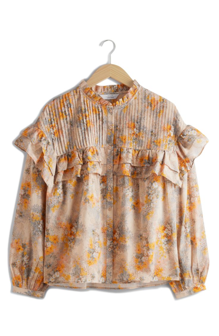 This billowy floral-print shirt is accented with crisp pintucks and romantic ruffles. 26" length (size Small) Front button closure Band collar Long sleeves with button cuffs 100% cotton Dry clean Imported Spring Feminine Blouse With Pintucks, Feminine Spring Blouse With Pintucks, Spring Pleated Tops, Feminine Blouse With Floral Print And Ruffled Collar, Fall Floral Print Blouse With Ruffled Collar, Floral Print Blouse With Ruffled Collar For Fall, Frilled Collar, Winter Sewing, Frill Blouse