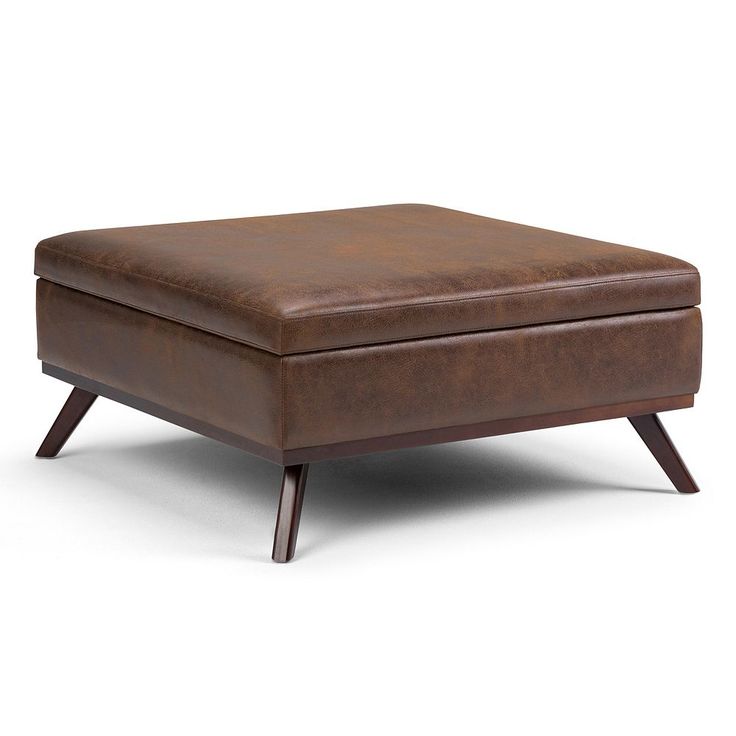 Style and function combine in this Simpli Home Owen square coffee table storage ottoman. Style and function combine in this Simpli Home Owen square coffee table storage ottoman. Distressed faux air leather and mid-century-inspired legs Interior storage compartment 36"H x 19.1"W x 36"D 19-in. seat height Weight capacity: 250 lbs. Product weight: 51.1 lbs. Faux Air Leather, rubberwood, hardwood Imported Wipe clean Assembly required Manufacturer's 1-year limited warrantyFor warranty information ple Modern Square Coffee Table, Large Square Coffee Table, Storage Ottoman Coffee Table, Coffee Table Storage, Lift Coffee Table, Square Storage Ottoman, Leather Storage Ottoman, Leather Storage, Ottoman Coffee