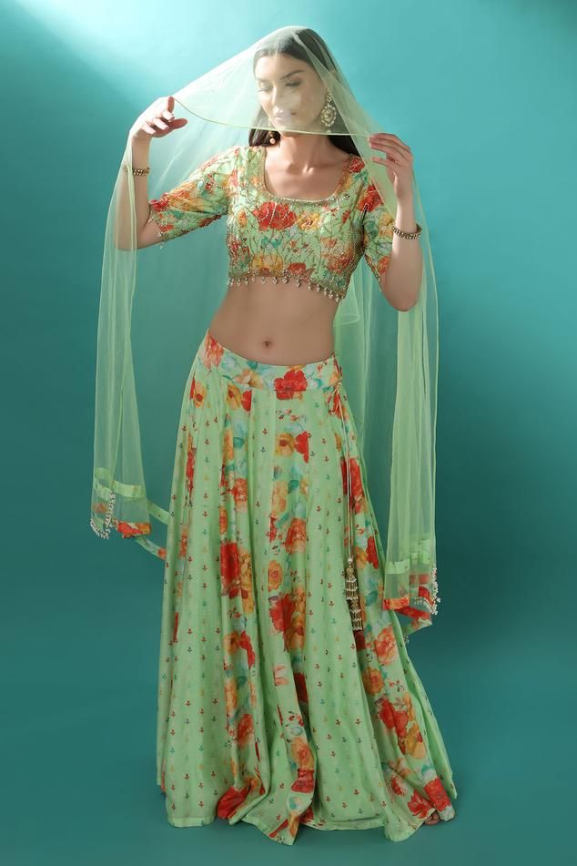 Mint green chanderi lehenga embroidered with pearls, cutdana and sequin. Paired with a tasseled padded blouse and dupatta.
Components: 3
Pattern: Embroidered
Type Of Work: Sequin, Pearl Cutdana
Neckline: Round
Sleeve Type: Elbow
Fabric: Lehenga and Blouse: Chanderi, Dupatta: Net
Color: Green
Other Details: 
Attached lining
Weight: Approx 2 kgs
Closure:
Lehenga: Zip, Hook and Eye
Length:
Blouse: 14.5 inches
Lehenga: 43 inches
Occasion: Mehendi and Haldi - Aza Fashions Green Dola Silk Sharara For Reception, Green Anarkali Set With Unstitched Blouse For Designer Events, Green Chanderi Set For Reception, Green Lehenga With Unstitched Blouse For Navratri, Designer Wear Green Sets With Resham Embroidery, Green Anarkali Set For Designer Wear, Designer Green Sets With Resham Embroidery, Green Sets With Resham Embroidery For Designer Wear, Unstitched Green Lehenga With Resham Embroidery