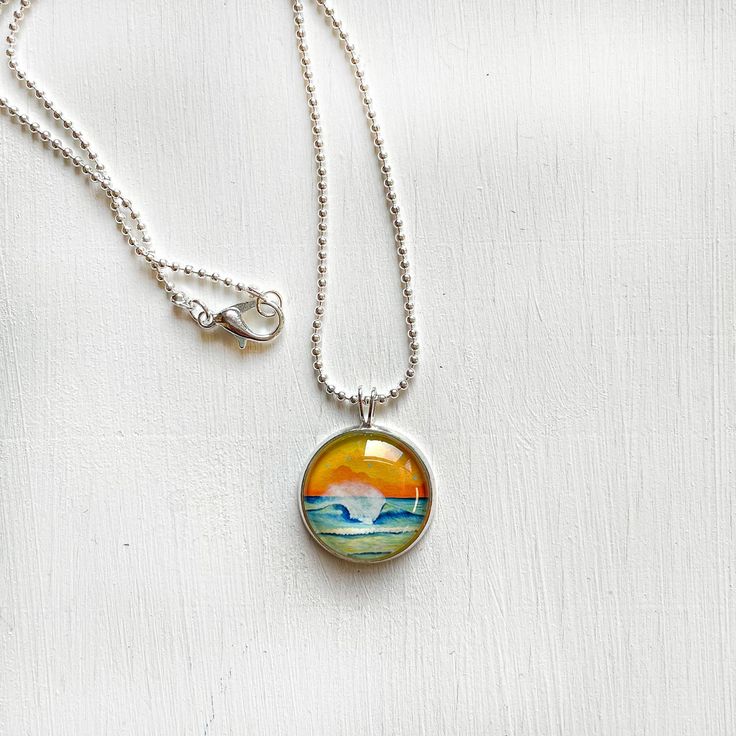 This cute necklace is silver plated, features a small print of one of my original paintings and comes with an 18 inch, also silver plated, dainty ball chain necklace. The size of the image is approximately 3/4 inch. **I've discontinued these necklaces after switching to stainless steel settings and chains (it's good not to have to worry about tarnishing metals when the items get handled often by many people, at shows and galleries) and that's why these are on sale. I won't sell these anymore, on Artsy Nickel-free Pendant Necklace, Artsy Sterling Silver Pendant Necklace, Artistic Nickel-free Silver Necklaces, White Ball Chain Necklace Perfect As A Gift, Artsy Nickel-free Necklace With Round Pendant, Artsy Silver Necklace With Large Pendant, Artsy Silver Round Pendant Jewelry, Artistic Adjustable Nickel-free Necklace, Artistic Adjustable Nickel-free Necklaces