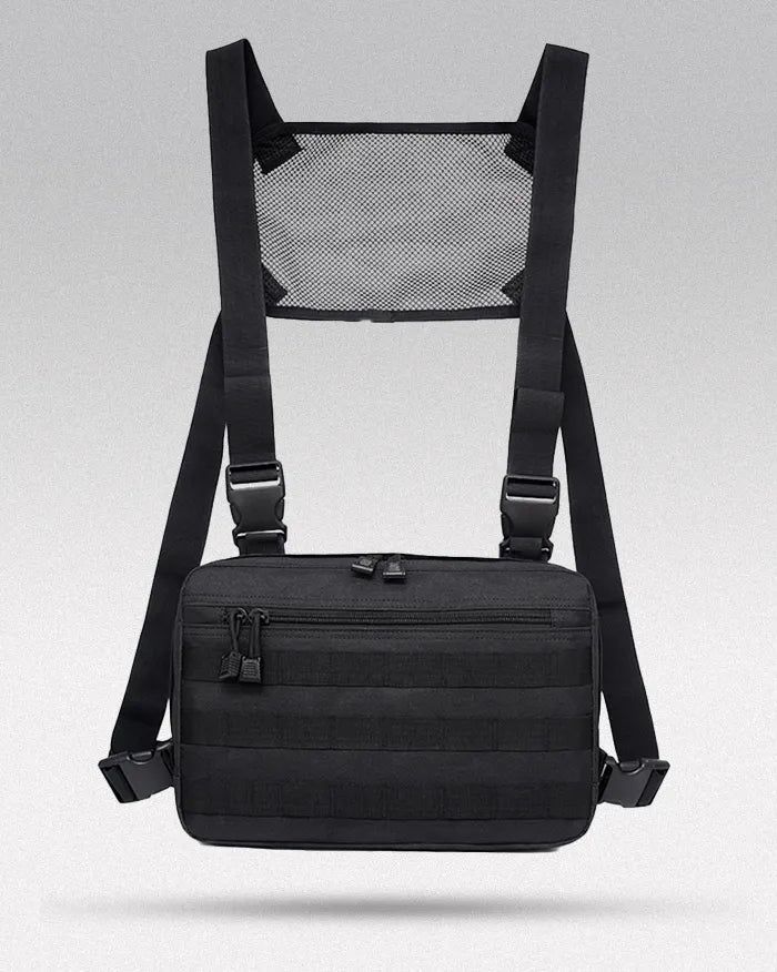 a black backpack with mesh back and shoulder straps on the front, sitting against a gray background