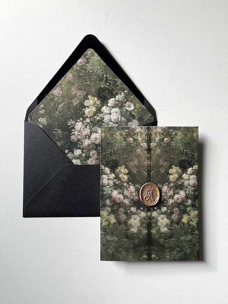 an open envelope with a floral pattern and a wax stamp on the front is shown