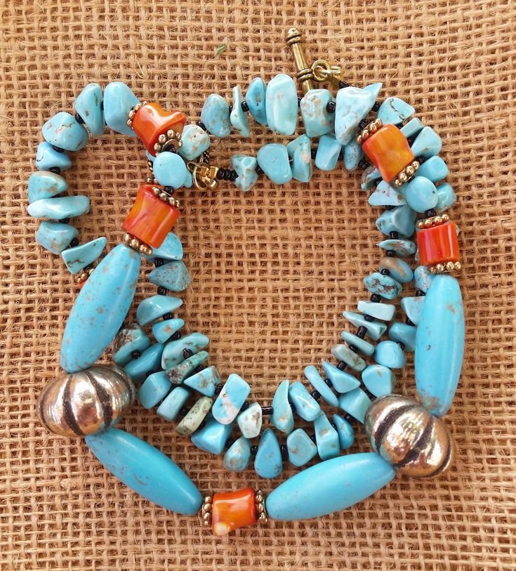 See More! www.etsy.com/shop/stonefoxarts The southwest and it's indigenous culture and art are close to my heart. My grandpa taught me jewelry making, and being from Arizona, that was his style of choice. I enjoy wearing and making southwestern style jewelry. This necklace features dyed teal howlite oblong oval focal beads at the central part of the necklace, the howlite is flanked by red coral beads that are up-cycled from a 1960s era vintage necklace, two up-cycled gold tone southwestern style Southwestern Style Turquoise Necklace With Natural Stones For Gift, Southwestern Beaded Turquoise Necklace For Healing, Southwestern Turquoise Necklace With Gemstone Beads For Festival, Southwestern Turquoise Necklace With Natural Stones For Gift, Southwestern Jewelry With Large Beads For Gifts, Artisan Turquoise Necklace With Gemstone Beads, Southwestern Jewelry With Large Beads As Gift, Southwestern Style Jewelry With Large Beads Gift, Adjustable Southwestern Jewelry With Large Beads