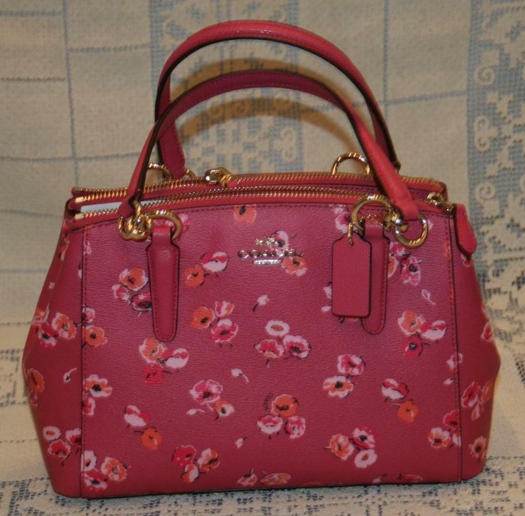 Coach Mini Christie Carryall Wildflower Dahlia Multi Pink Purse Handbag NWT New Welcome!  Here you will find a New With Tags, Coach Mini Christie Carryall Wildflower Dahlia Multi pink Purse / handbag / crossbody.  This was bought new at the Coach outlet store and was never used.   Color: Dahlia Multi Wildflower Beautiful COACH Mini Christie carryall in wildflower dahlia. Fun bag for all seasons! Very stylish bag with 2 zipper compartments and snap closure. fabric lining Handle with 5 3/4" drop T Floral Print Top Handle Bag For Travel, Coach Shoulder Bag For Spring Travel, Spring Coach Shoulder Bag For Travel, Multicolor Floral Print Top Handle Shoulder Bag, Multicolor Floral Print Top Handle Bag, Spring Floral Print Double Handle Bags, Coach Bags With Detachable Handle For Spring, Coach Everyday Bags For Spring, Coach Bags For Everyday Spring Use