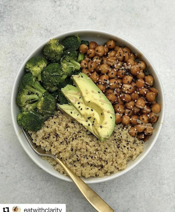 a bowl filled with rice, broccoli and chickpeas