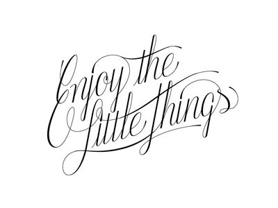 the word enjoy the little things written in cursive writing on white paper with black ink