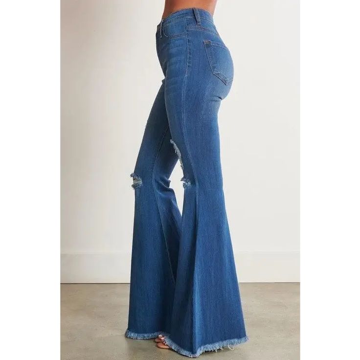 A pair of exaggerated, high-rise flare jeans featuring a front whiskered wash, open distressed knee detail, classic 5-pocket construction, frayed raw hem, and a zip-fly closure. -Rise: 11" Inseam: 33" -Model is 5'8" and wearing a size 3 -True to size Clothing Capsule, Flare Denim Jeans, Denim Flares, Day And Night, Capsule Wardrobe, Flare Jeans, Bell Bottom Jeans, Denim Jeans, Women's Clothing