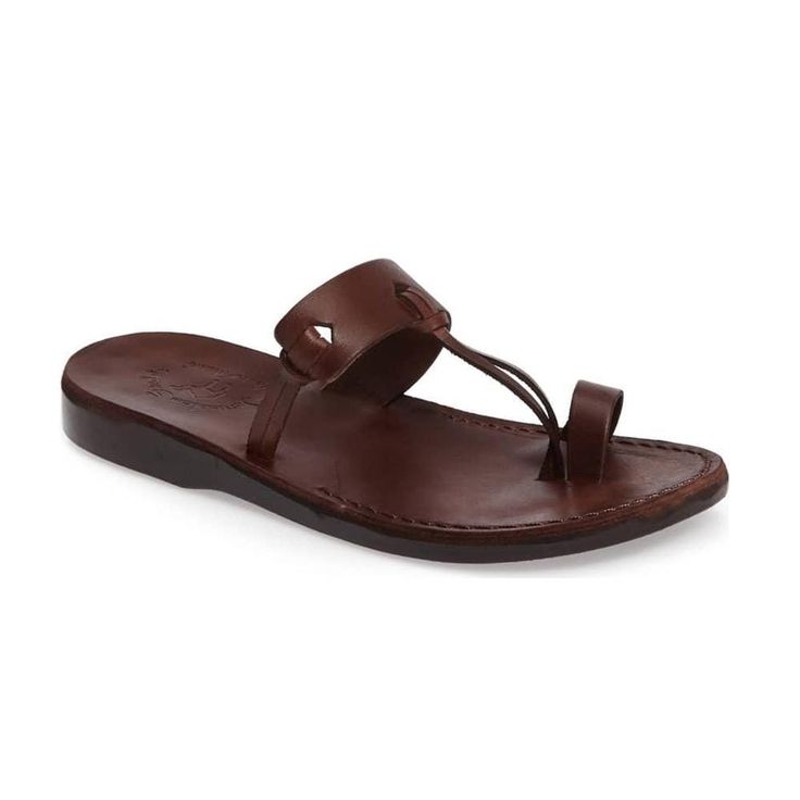 The David men's toe loop sandal is a modern-day minimalist. Slide into this open-back flip flop with a barely-there design and free yourself from life's complications.  The thick arch strap and secure toe loop deliver just enough structure to keep you grounded while the 100% vegetable tanned leather insole conforms to the contours of your unique footprint with every step. These water-resistant toe loop sandals soften and develop a rich patina over time, making them your perfect fit for wading through red tape and climbing corporate ladders.   Our artisans finish each Jerusalem Sandal by hand for a custom look and feel you simply cannot find in mass-produced footwear. Step confidently into your future in the fabulous freedom of our bestselling men's toe loop sandals.Vegetable-tanned natural Natural Leather Sandals, Mens Slide Sandals, Toe Loop Sandals, Mens Shoes Sandals, Mens Slides, Free Yourself, The David, Brown Leather Sandals, Open Toe Sandals