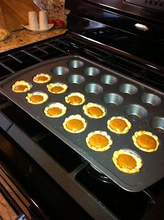 muffin tins are lined up on the stove to bake in an oven