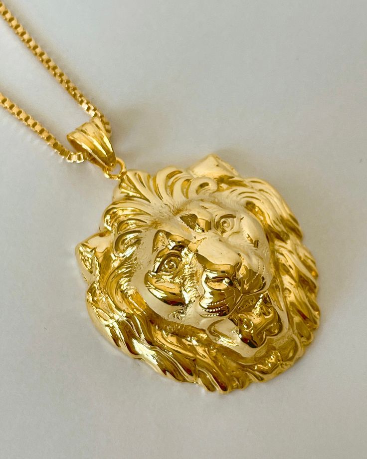 The Gold Lion Pendant Necklace is handmade, vintage inspired by the iconic lion's head door knockers in Paris.  The pendant is 18K gold plated silver, on gold filled box chain, 1.5 mm thick. All items come in a gift box ready to gift. To see more please visit  https://www.etsy.com/shop/BijouLimon Bijou Limon jewelry collections present a romantic French spin on the latest jewelry trends. Based on the US West Coast but French at heart, Bijou Limon interprets the current jewelry trends and deliver Luxury Gold Zodiac Jewelry, Luxury Yellow Necklaces For Gift, Luxury Gold Mythological Style Necklaces, Leo Mathild Jewelry, Luxury Yellow Gold Custom Necklace, Luxury Gold Mythological Necklaces, Luxury Yellow Gold Necklaces For Anniversary, Luxury Yellow Gold Symbolic Necklace, Luxury Yellow Gold Necklace Gift