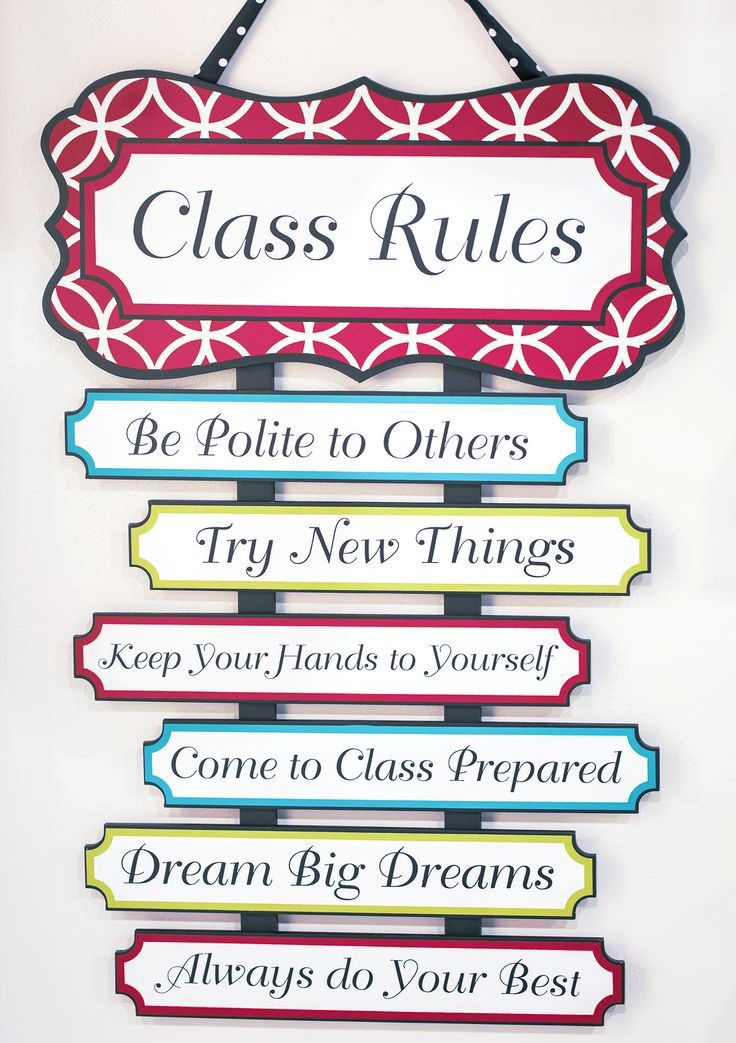 a sign hanging from the side of a wall that says class rules be polite to others try new things keep your hands to yourself come