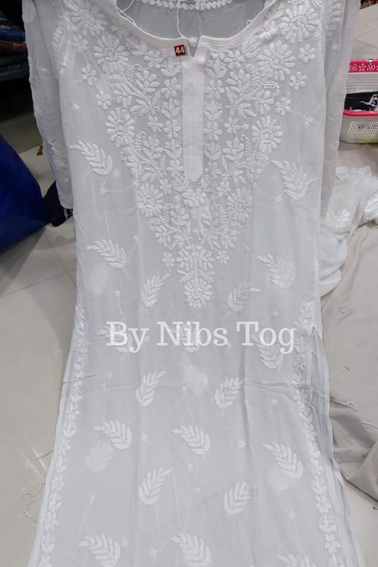 Nibs Tog White Chikankari Kurta Palazzo Set for Women with FREE Matching Inner, Premium Viscose Georgette Chikankari Kurti A premium Chikankari Kurta for any ethnic look, available in multiple colours. Pair up with palazzo or pant for full ethnic look. Shop More Chikankari outfits by Nibs Tog on our Shop : https://www.etsy.com/in-en/shop/NibsTog Features: Fabric: The beautiful Chikankari Kurta is made of Pure Viscose Georgette Fabric.  The Kurti is comfortable to wear. The inner is made of Cotton fabric. Chikankari Pant is made of pure cotton fabric & comfortable to wear. Chikankari Palazzo is made of Viscose Georgette fabric with attached cotton linning. Style: The Chikankari Kurta is made in straight style with beautiful hand embroidery around the neck.  It has motifs embroidered on rest White Churidar With Floral Embroidery For Transitional Season, White Salwar Kameez With Floral Embroidery For Transitional Seasons, Transitional White Salwar Kameez With Floral Embroidery, Unstitched Cutwork Traditional Wear For Diwali, White Cutwork Dupatta For Designer Wear, Bollywood Style Traditional Wear With Cutwork For Eid, Wedding Straight Kurta With Cutwork, Wedding Traditional Wear Straight Kurta With Cutwork, Wedding Dupatta With Cutwork For Festivals