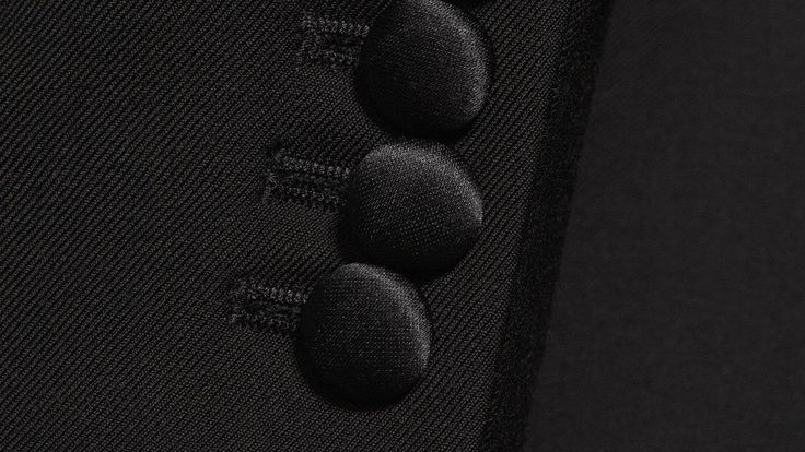 With the latest laser dye technology, Drago (Italy) have created a fabric that is even darker than most regular black tuxedos. This is a 270 gr/mt, all-seasonal fabric, backed by a Super 130S, 100% Wool rating, ensuring exceptional quality, while still being durable and suitable for frequent use (if desired). Of course, it’s a black tuxedo, so this number should be reserved for formal (Black Tie) evening events, where a “Dinner Jacket” is expected.  Functional sleeve buttons & half-canvas constr Black Silk Tuxedo For Evening, Black Silk Tuxedo For Evening Events, Black Tuxedo With Hidden Button Closure For Black Tie, Black Tuxedo With Pressed Crease For Evening, Black Evening Tuxedo With Pressed Crease, Luxury Black Blazer For Black Tie Events, Luxury Tuxedo With Button Closure For Formal Events, Luxury Tailored Tuxedo With Buttons, Luxury Tuxedo With Button Closure For Formal Occasions