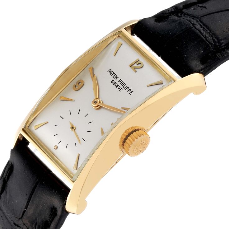 Patek Philippe Hour Glass Yellow Gold Silver Dial Vintage Mens Watch 2468. Manual winding movement. 18k yellow gold case 23.0 x 39.0 mm. . Acrylic domed crystal. Silver dial with raised applied gold Arabic numeral and dagger shaped hour markers Small seconds sub-dial at 6 o'clock. Black leather strap with 18 k yellow gold tang buckle. Classic Yellow Gold Diamond Watch With Round Dial, Classic Formal Diamond Watch With Polished Finish, Classic Yellow Gold Diamond Watch With Polished Finish, Classic Yellow Gold Chronometer Watch, Classic Yellow Gold Watch With Chronometer, Classic Yellow Gold Watches With Subdials, Classic Gold Diamond Watch With Subdials, Classic Yellow Gold Watches With Polished Finish, Classic Yellow Gold Watch Accessories With Subdials