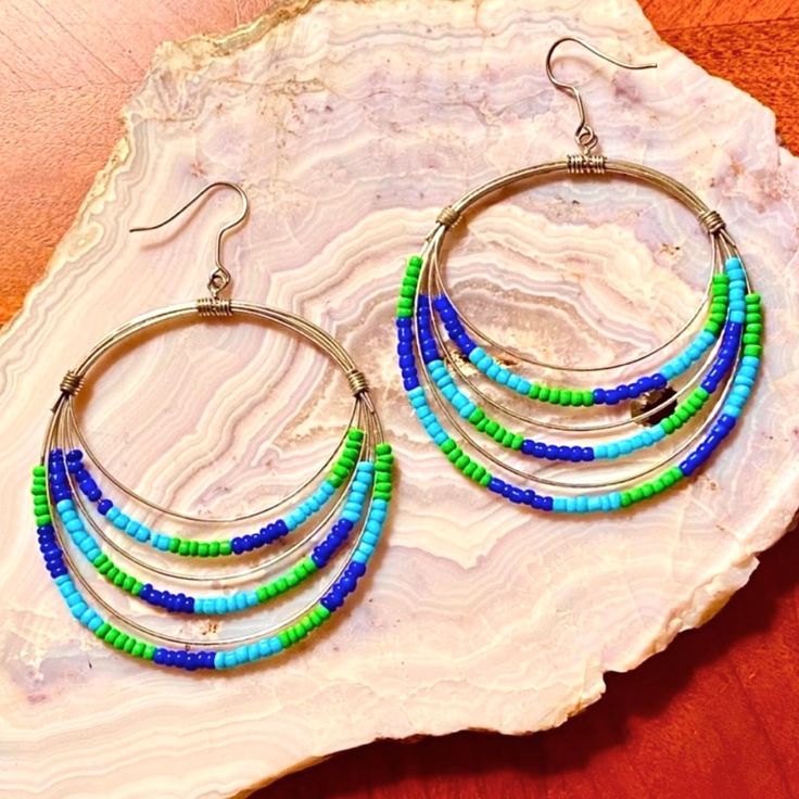 Gorgeous Beaded Silver Hoop Earrings In Multi-Layered Light Turquoise, Cobalt Blue & Spring Green Beads. Strikingly Beautiful, Unique & Lightweight On The Ear. The Flattering Boho Design Is Sure To Become Your Favorites & Looks Fantastic With Blue Jeans, Jean Shorts & Skirts. It Also Looks Wonderful With More Structured Styles When You Want To Make A Strong Statement. Approx. 3” Long, 2 1/8” Wide. Brand New, Never Worn. Nwot Blue Spring, Anthropologie Jewelry, Boho Design, Green Beads, Shorts Skirts, Blue Springs, Beaded Hoop Earrings, Boho Designs, Beaded Hoops