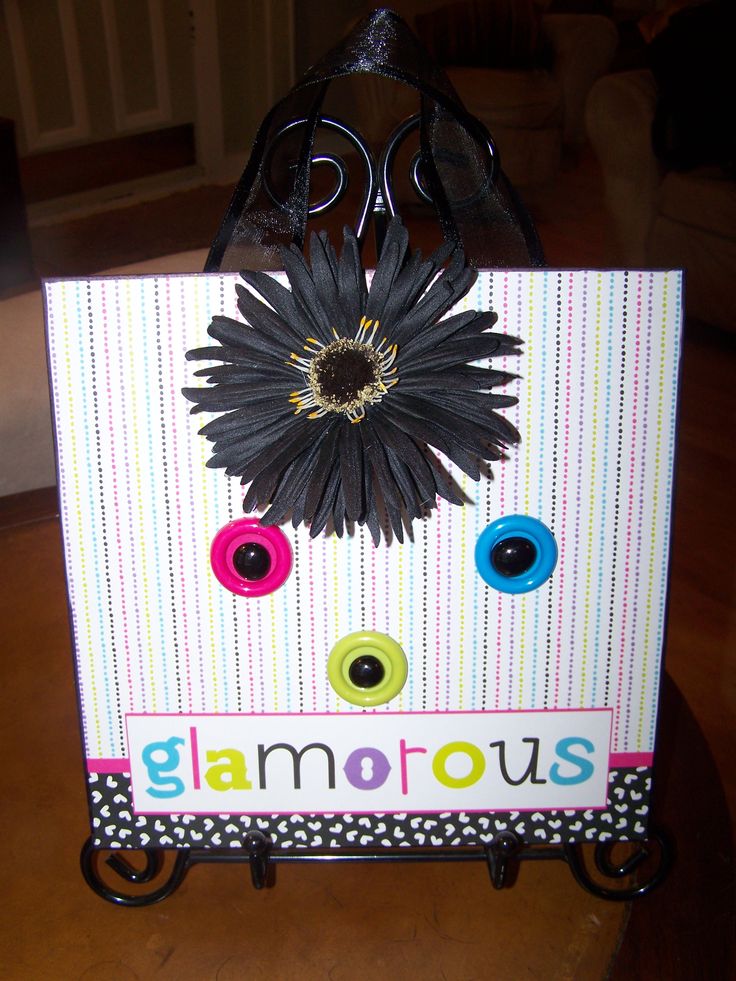 a handbag made to look like a flower with the word glamours on it