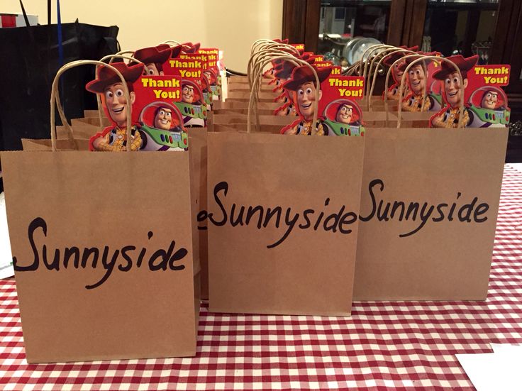 some brown paper bags sitting on top of a table