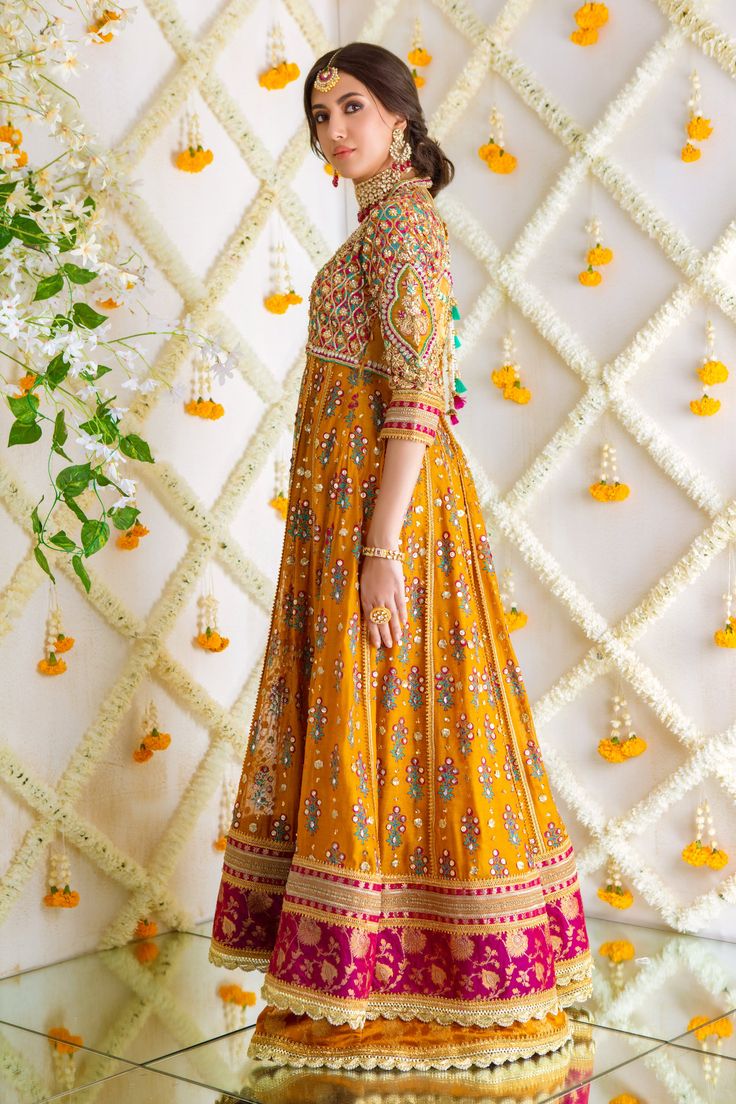 Step up your festive dressing game with our beautifully crafted ensemble, gorgeous hand block printed kalidar, heavily embellished with sequins, beads and gota boti chan, neckline and sleeves are beautifully adorned with gorgeous zardozi work, stunning magenta hued appliquéd border on hem finishes it beautifully, gorgeous detailed back and hand-made tassels gives entire outfit a trendy element. This stunning kalidar is offset with jamawar Lehanga and gorgeous Maysuri dupatta featuring gota motif Kundan Palazzo Set With Dabka Work Straight Kurta, Palazzo Set With Dabka Work And Kundan Straight Kurta, Palazzo Set With Dabka Work And Straight Kurta, Straight Kurta Set With Kundan And Dabka Work, Festive Palazzo Set With Straight Kurta And Mirror Work, Festive Palazzo Set With Mirror Work, Bollywood Style Chinon Kurta For Reception, Raw Silk Anarkali Set With Dabka Work For Reception, Reception Dabka Work Raw Silk Anarkali Set