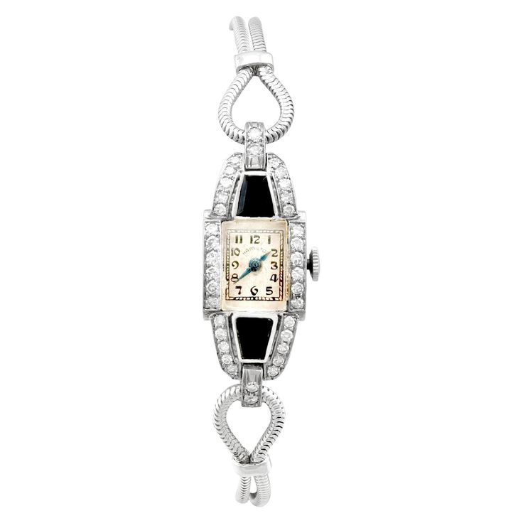 An impressive vintage Art Deco 0.95 carat diamond and black onyx, platinum cocktail watch by 'Hamilton'; part of our diverse antique jewelry and estate jewelry collections. This impressive vintage Art Deco diamond watch has been crafted in platinum. The watch has a rectangular dial with plain black Arabic hour numerals displayed within rectangular designs, the outer one marked as the chapter ring. The Art Deco watch is fitted with shaped, blued steel hands, and the face clearly displays the text Cocktail Watch, Art Deco Watch, Art Deco Lady, Cocktail Art, Art Deco Diamond, Women Wrist Watch, Art Deco Jewelry, Diamond Watch, Plain Black