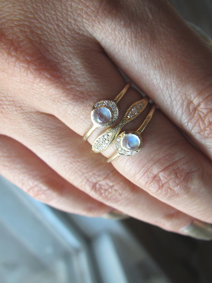 Within women lives the power to create, nourish and renew. Let's take the time to reflect on and celebrate this unique power. 4mm rainbow moonstone. White round brilliant diamonds 0.03cts. #moonstonering #moonstonejewelry #ringstack #goldringstack #rings #goldjewelry 14k Gold Moonstone Promise Ring With Rose Cut Diamonds, Fine Jewelry Moonstone Promise Ring With Rose Cut Diamonds, Celestial Moonstone Jewelry With Rose Cut Diamonds, Diamond White Moonstone Ring With Rose Cut Diamonds, Moonstone Promise Ring With Single Cut Diamonds, Moonstone Rings With Rose Cut Diamonds, Elegant Stackable Moonstone Ring With Diamond, Dainty Diamond Moonstone Ring For Anniversary, Celestial Stackable Moonstone Ring For Anniversary