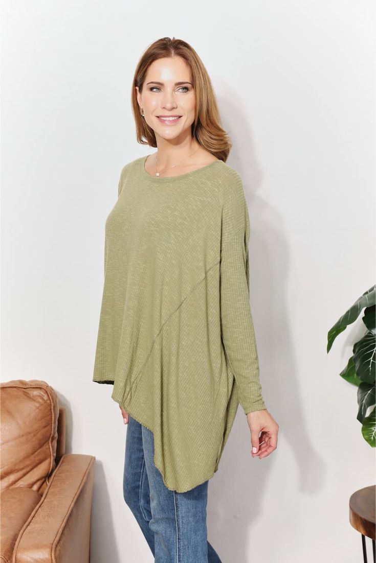 This top offers a harmonious blend of comfort and modern flair. Crafted from ultra-soft ribbed fabric, this top envelops you in luxurious coziness while maintaining a sleek aesthetic. The oversized fit exudes relaxed elegance, creating a versatile piece perfect for layering or wearing on its own. The unique sharkbite hem adds a dynamic touch to the design, allowing for a graceful drape and a hint of asymmetry. With its understated detailing and plush texture, this top becomes an essential additi Relaxed Elegance, Sleek Aesthetic, Rib Knit Top, Layered Tops, Ribbed Top, Fall Sweaters, Basic Style, Dress Romper, Ribbed Fabric