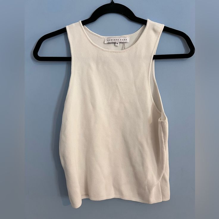 Never Worn Chic White Stretch Tank Top, Spring White Stretch Tank Top, Chic White Tank Top For Day Out, White Fitted Chic Tank Top, Fitted V-neck Cream Tank Top, Spring Crew Neck Soft-washed Tank Top, Soft-washed Cotton Crew Neck Tank Top, Beige Stretch V-neck Tank Top, White Sweaters