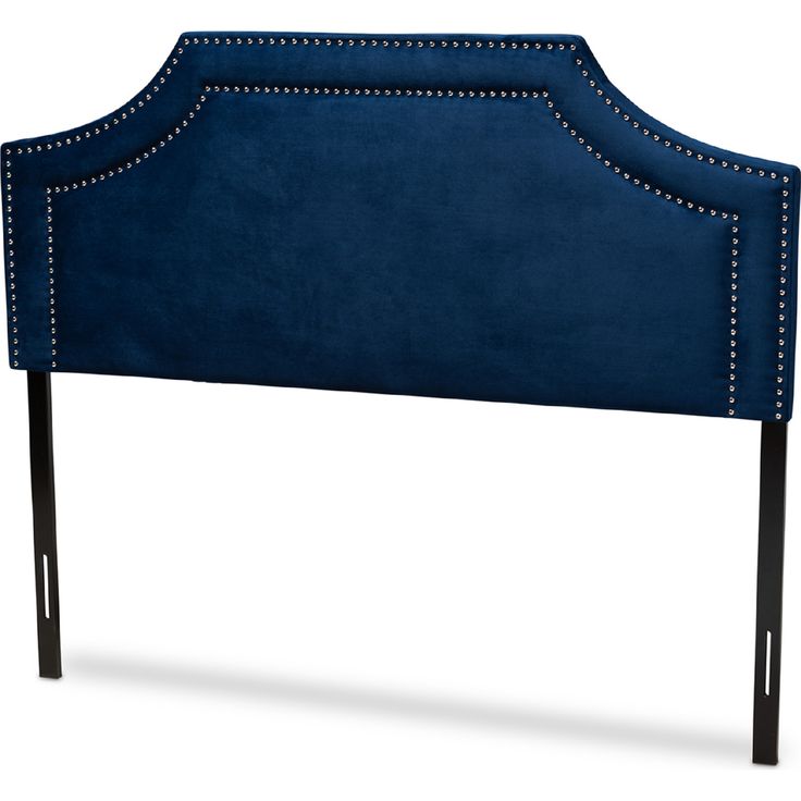 a blue headboard with studding on it