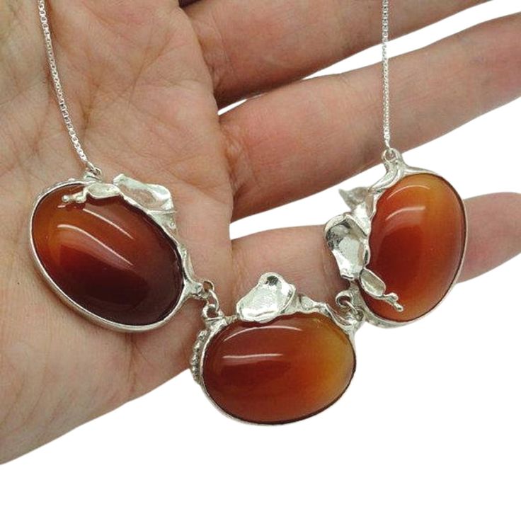 Red Carnelian & Sterling silver necklace SPECIAL NOTES: If you liked my shop and this item and didn't receive an offer code, please feel welcome to let me know, and I will personally send you the (discount) code. If you like this jewelry, you can always save it on Pinterest, share it, and see what your loved ones think Material & Dimensions: center 3 natural oval Carnelian gemstones 20mm silver chain on each side Material: Sterling Silver 925 Gemstones: Carnelian Extra Care: Labeled and Unique Orange Sterling Silver Necklace, Carnelian Cabochon Necklaces For Jewelry Making, Amber Cabochon Necklaces In Sterling Silver, Amber Sterling Silver Necklaces With Cabochon, Silver Carnelian Gemstone Jewelry, Amber Cabochon Necklace In Sterling Silver, Amber Sterling Silver Necklace With Cabochon, Round Carnelian Necklaces With Polished Finish, Silver Carnelian Cabochon Jewelry