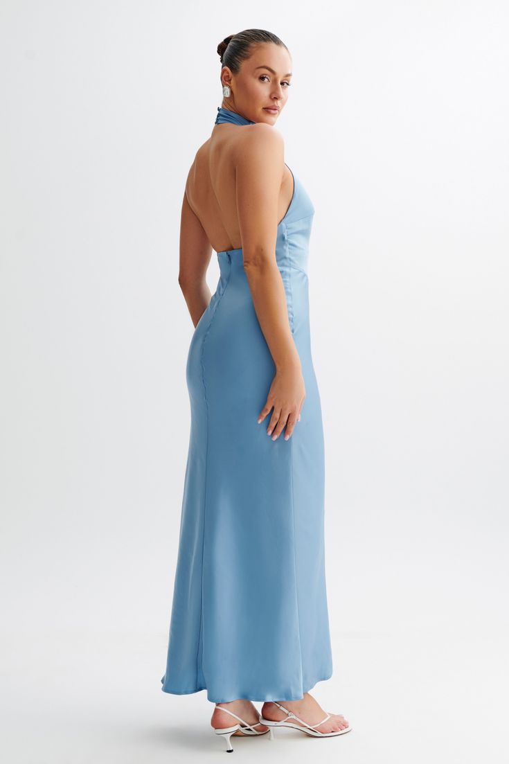 Unmatched beauty.The BELLADONNA Satin Halter Maxi Dress is an exquisite choice for elegant evenings and special occasions. This dress features a chic halter neckline with a front bust cutout that adds a touch of allure. The straight skirt flows gracefully to the floor, complementing the open back design for a striking silhouette. Fully lined for comfort, the dress also includes a centre back invisible zip for a seamless finish. With its sophisticated style and luxurious satin fabric, the Bellado Maxi Dress Sale, Halter Maxi Dress, Halter Maxi, Beige Dresses, Halter Maxi Dresses, Invisible Zip, Straight Skirt, Crepe Dress, Halter Neckline