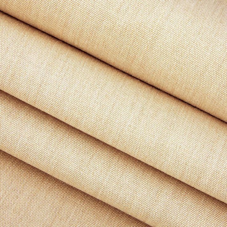 a close up view of the fabric material for a bed sheet that has been made in beige