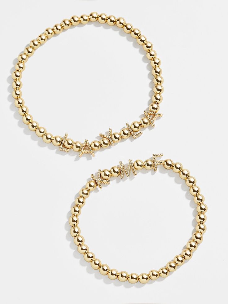 Orders placed through 12/3 11:59pm EST will be delivered by 12/19.Add an extra special touch to your wrist stack with this classic design that's completely customizable. Our Custom Gold Twist Pisa Bracelet takes our beloved gold bead silhouette and adds twisted gold letter beads, each spaced apart by two beads in between. Add a name, phrase, or group of initials to create a piece you'll never take off. See our Letter Key for all options available. This bracelet features 5mm beads. Trendy Gold Charm Bracelet With Letter Beads, Gold Charm Bracelet With Letter Beads For Friendship, Gold Letter Beads Charm Bracelet For Friendship, Gold Metal Beaded Bracelets For Friendship, Trendy Gold Name Bracelet For Friendship, Trendy Gold Friendship Name Bracelet, Trendy Gold Friendship Bracelet, Personalized Gold Metal Beaded Bracelets, Trendy Gold Bracelet With Round Beads