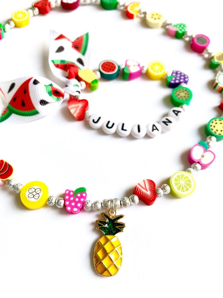 Hello everyone, welcome to my shop. This is a personalized/customized fruit stretch bracelet and necklace set for little girls. Perfect for girls as everyday summer jewelry. I will choose random fruits and ribbons to make your bracelet, I will always try to get as close as possible to original but stock may vary. I will need to know the name of your child (leave me a note at checkout section) and your child's wrist. (in inch- find your size in the menu) Can be made without the ribbon, leave me a Fun Summer Necklaces For Gifts, Cute Adjustable Summer Jewelry, Cute Summer Jewelry For Birthday, Colorful Fun Summer Jewelry, Cute Summer Birthday Jewelry, Summer White Jewelry With Fruit Design, Summer Fruit Design White Jewelry, Playful Rainbow Jewelry For Summer, Summer Rainbow Playful Jewelry