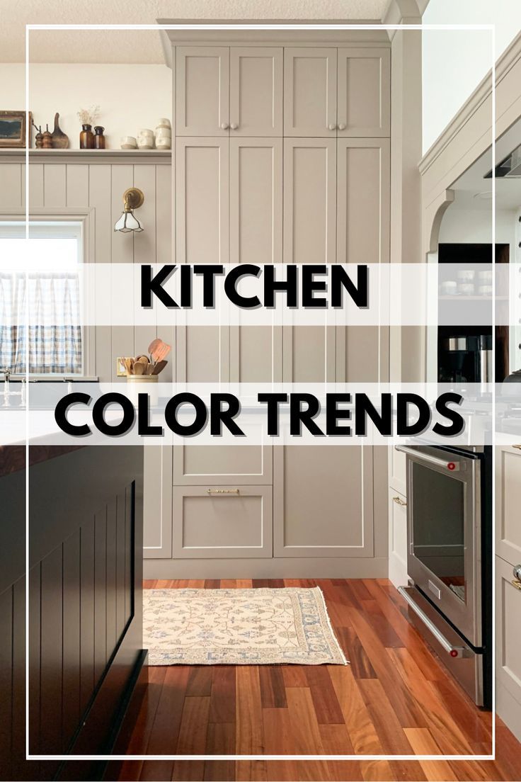 a kitchen with white cabinets and wood floors is featured in the article, kitchen color trends