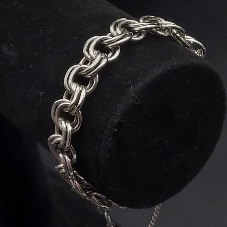 This vintage Monet bracelet features silver tone chain links and measures 7.5" L. It has a safety chain and is signed on both a hang tag and on the back of the clasp Vintage Monet, Safety Chain, Chain Links, Vintage Costume Jewelry, Hang Tags, Vintage Costumes, Chain Link Bracelet, Kingston, Link Bracelets